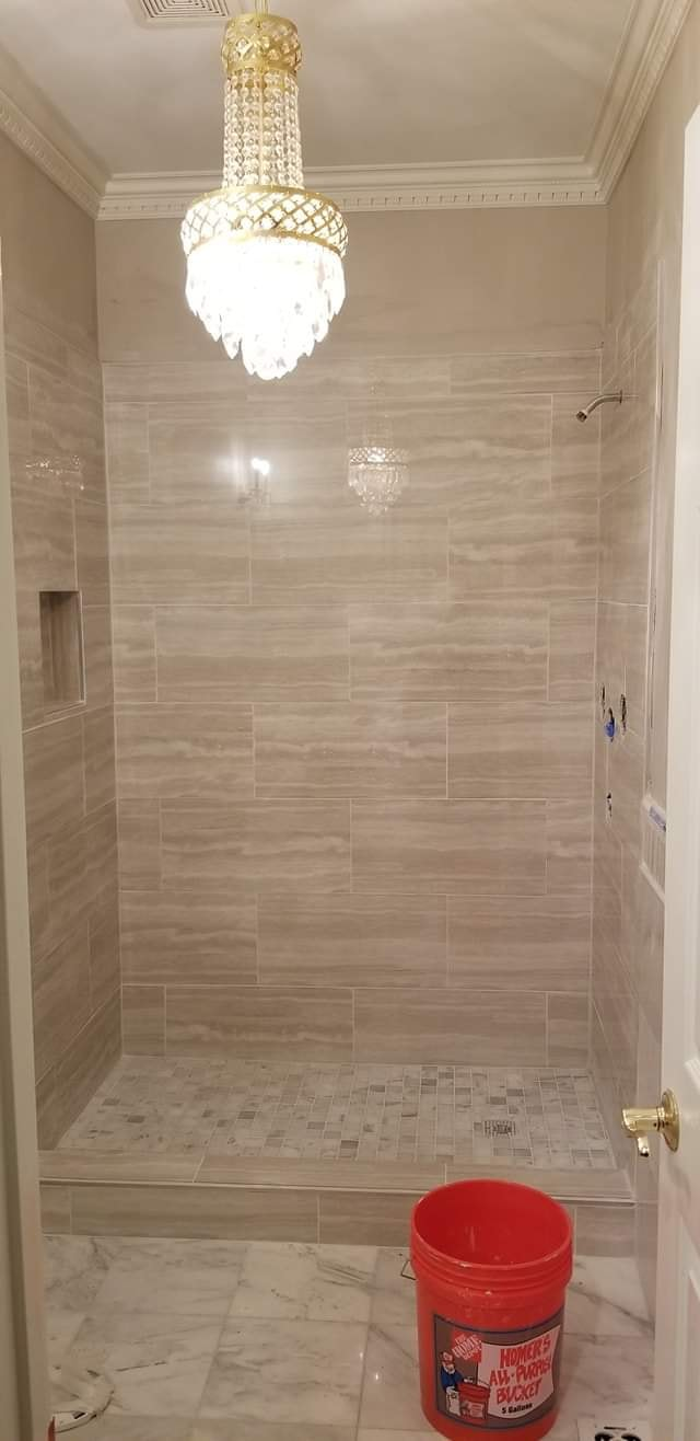 Custom tile shower with crystal chandelier in progress