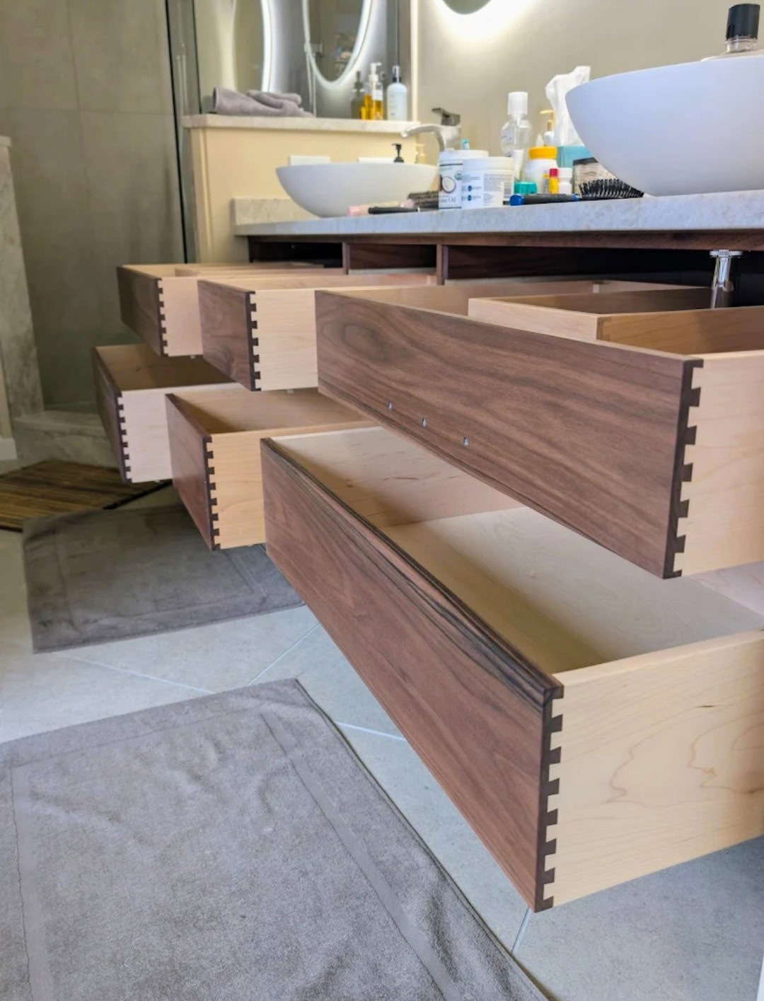 Custom walnut vanity with dovetail drawer boxes and vessel sink