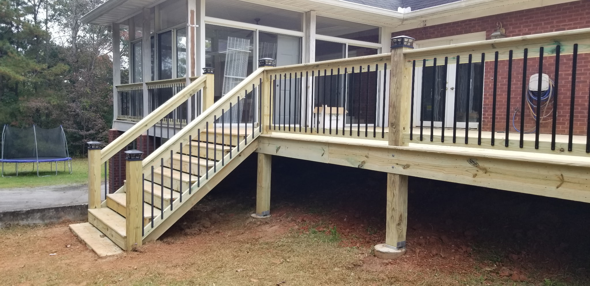 New deck with staircase and black aluminum balusters