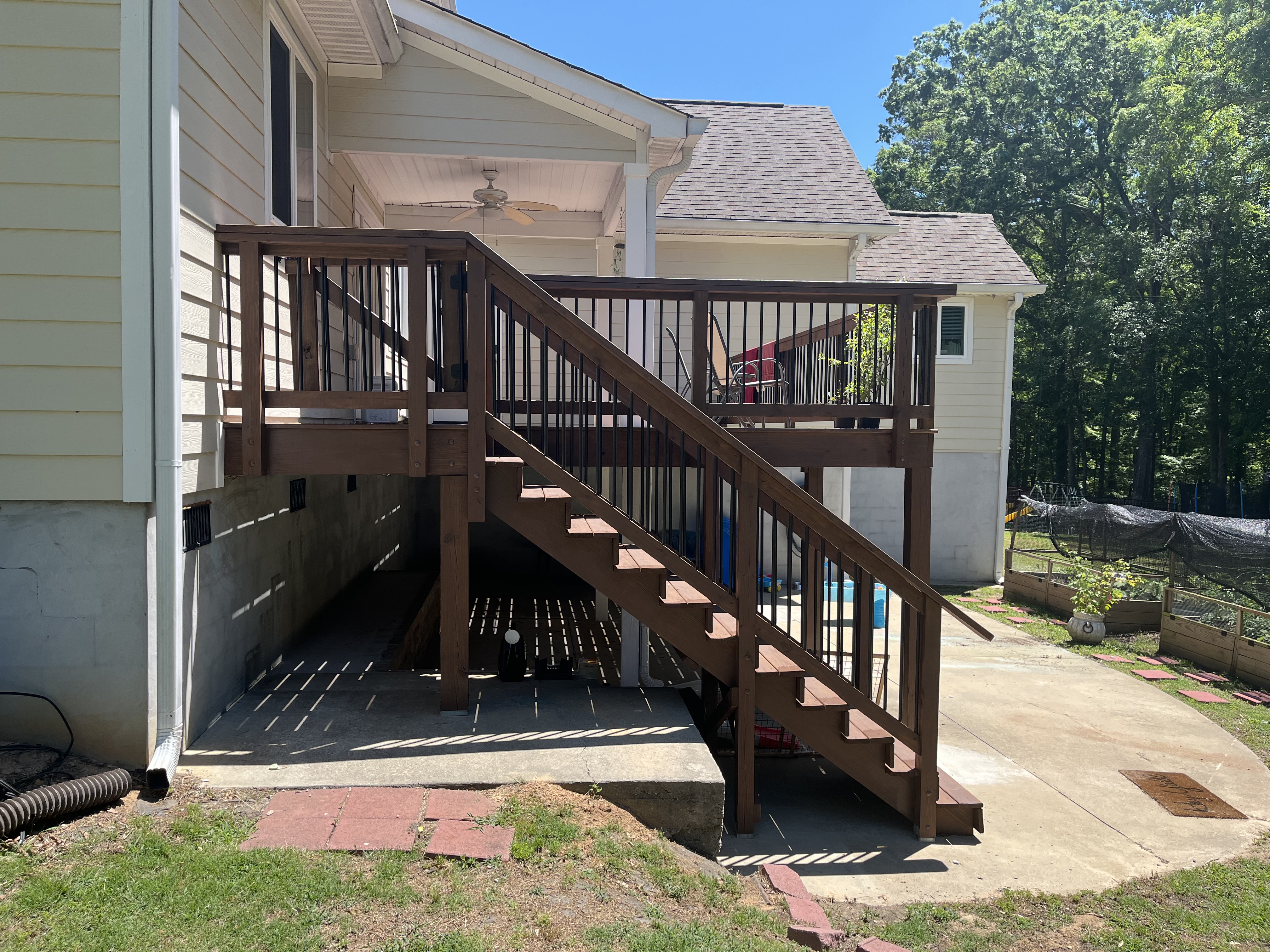 Elevated deck with covered porch section and staircase