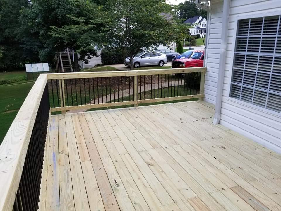 New pressure treated wood deck with black aluminum rail system