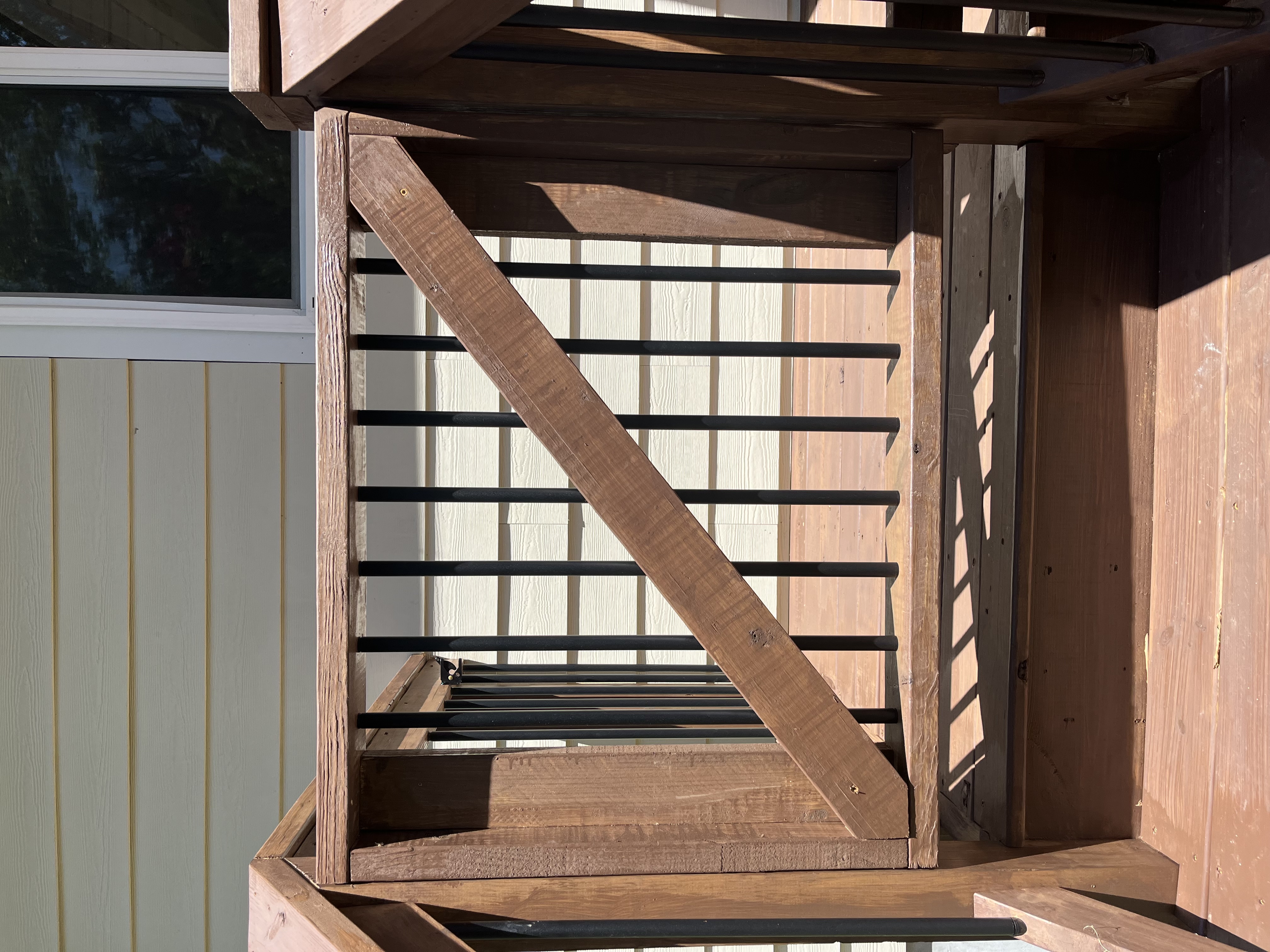 Custom deck gate with black metal balusters
