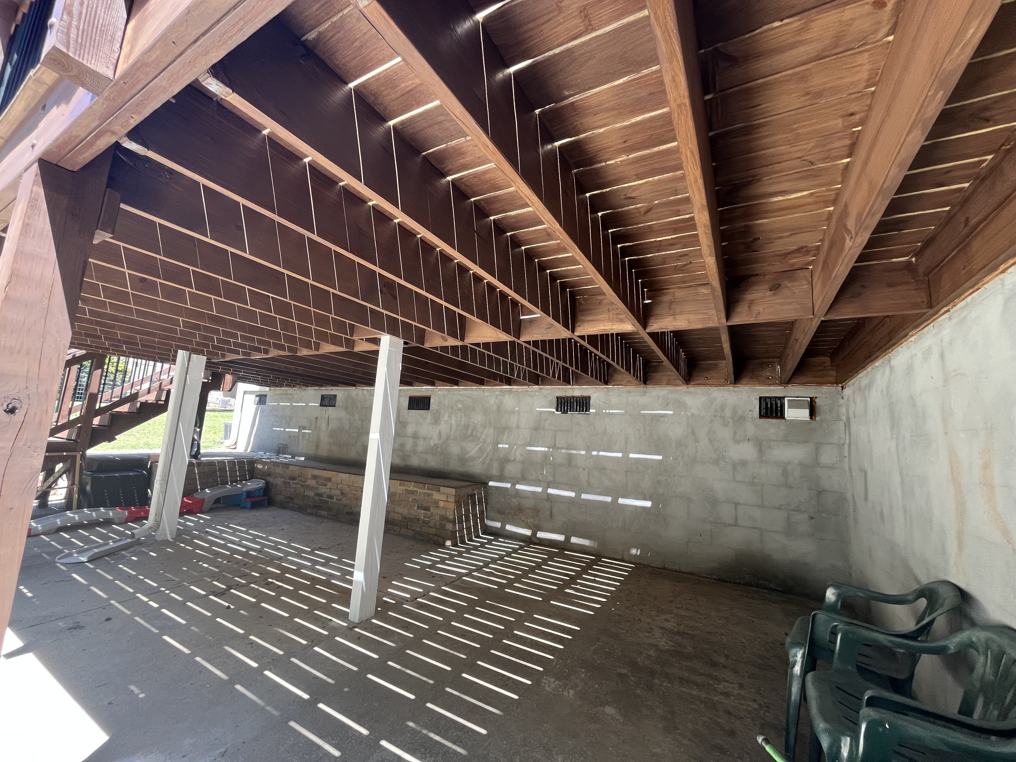 Under-deck framing and structural work on elevated deck build