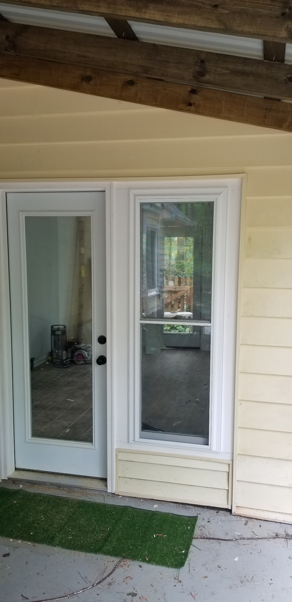 Exterior door with sidelight and pet door installed